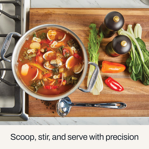 All-Clad ladle handle detail with ergonomic finger grip and hang loop for comfort and storage
