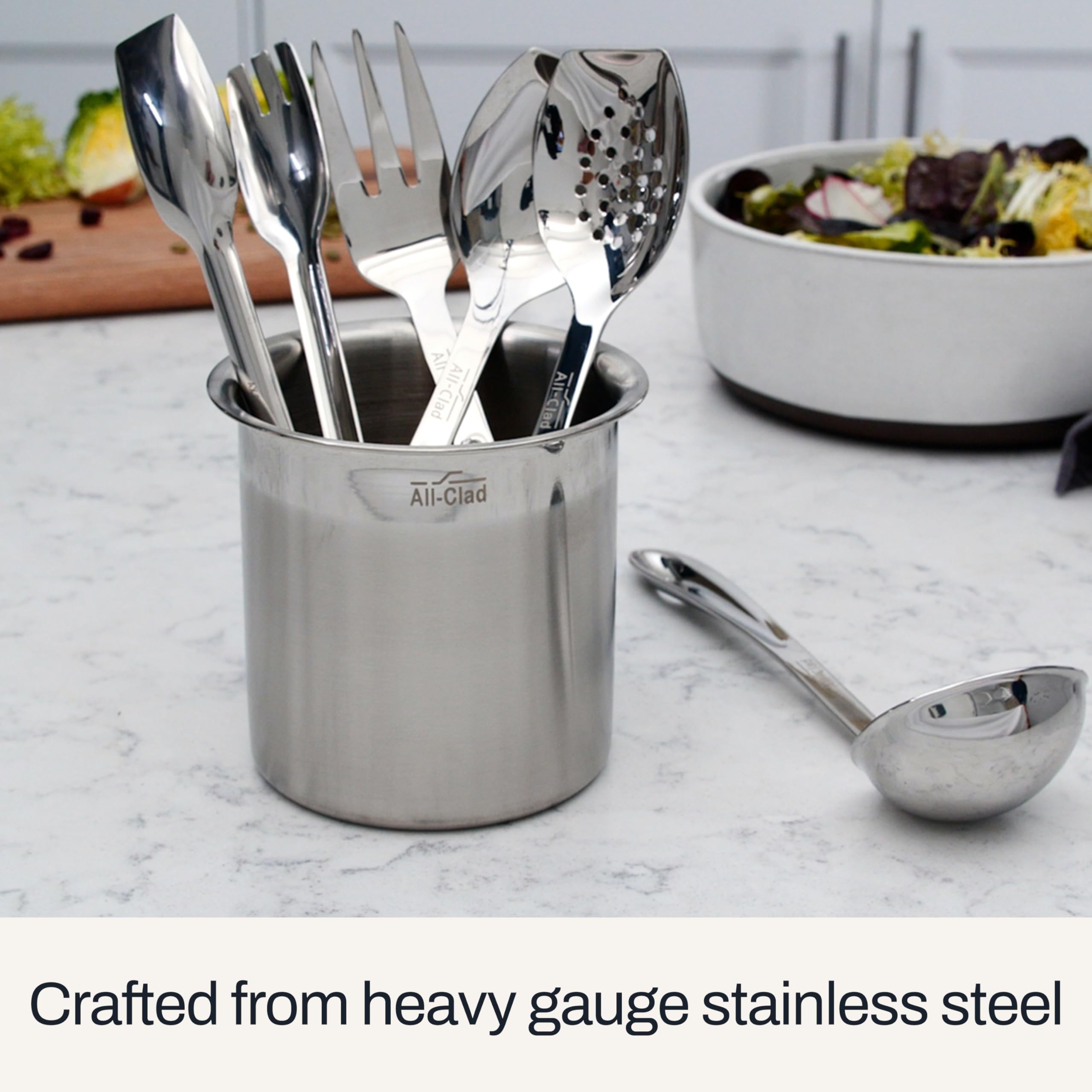 All-Clad ladle in use serving soup into a bowl, demonstrating portion control and balance