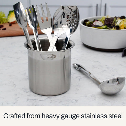 All-Clad ladle in use serving soup into a bowl, demonstrating portion control and balance