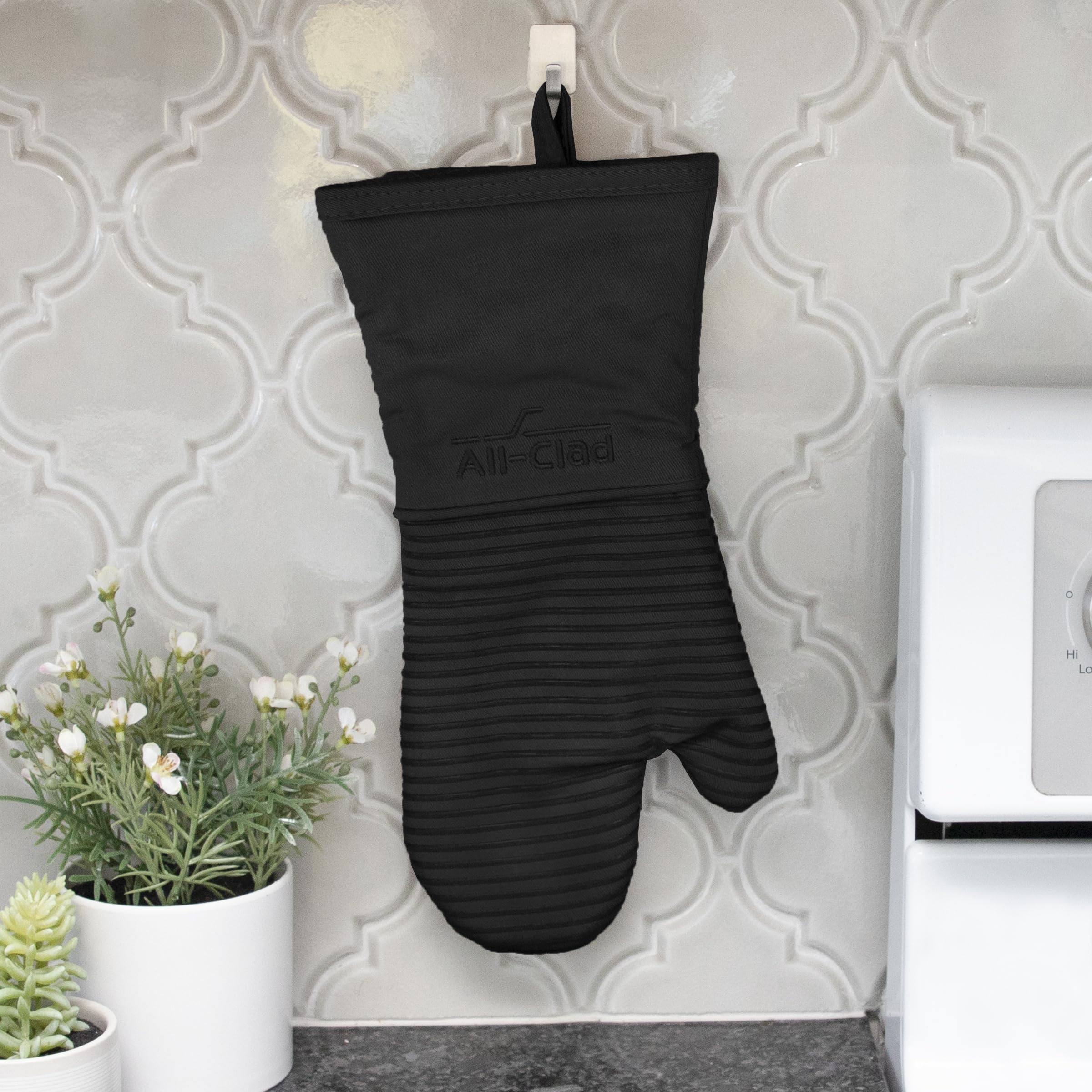 All-Clad mitts hanging by loop for easy storage and quick kitchen access