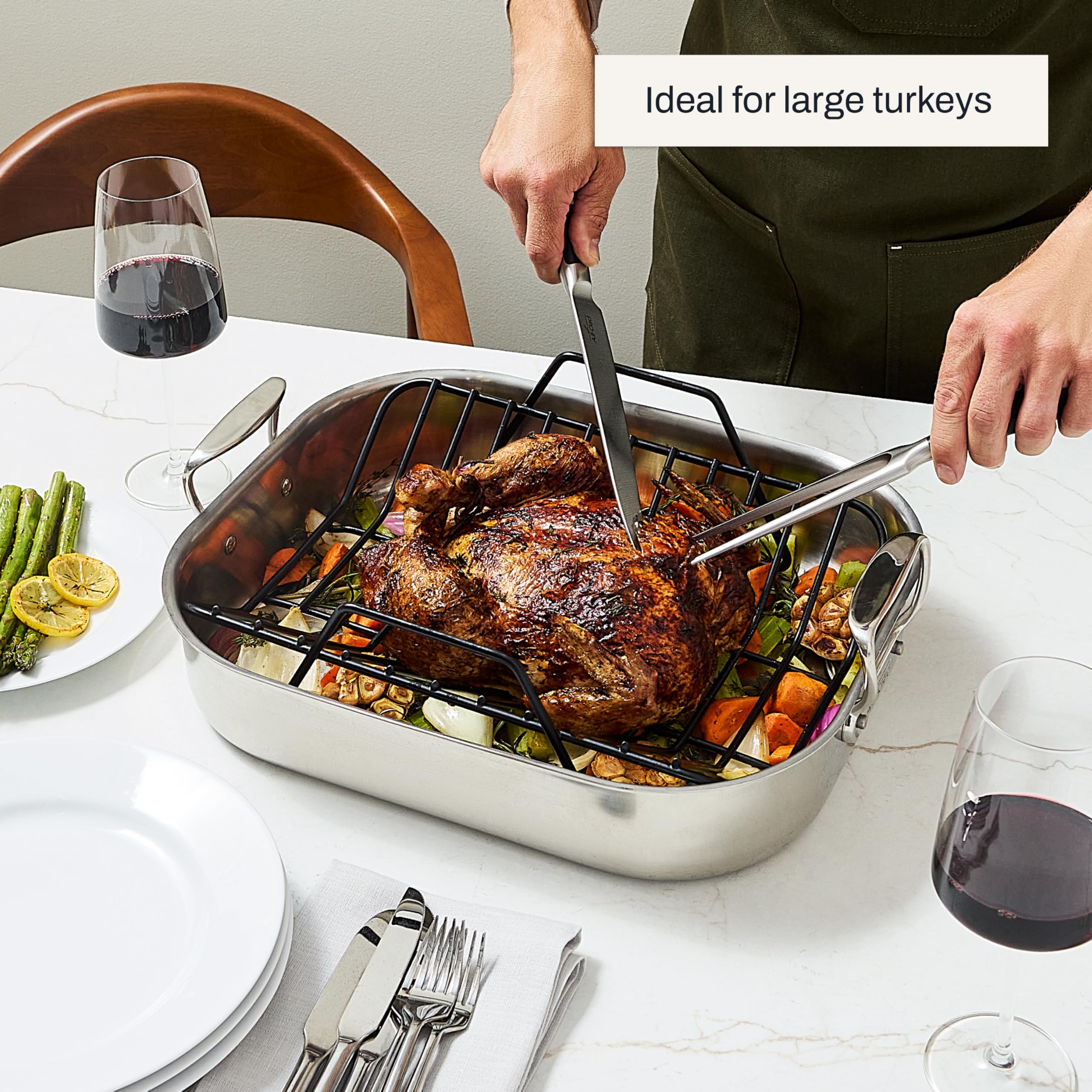 All-Clad roaster with a roasted turkey in oven illustrating even browning and capacity