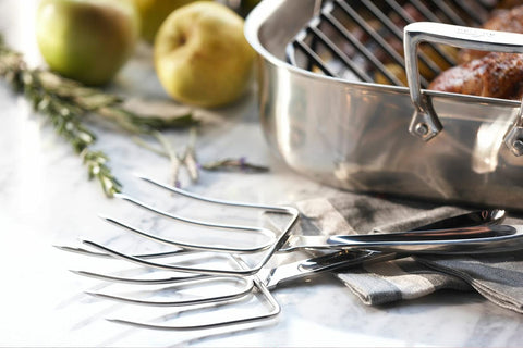 All-Clad spoon next to measuring cup showing 10-inch scale for precise reach benefit