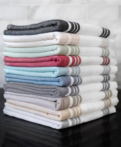 All-Clad stacked towels beside ruler showing oversized 17x30 benefit