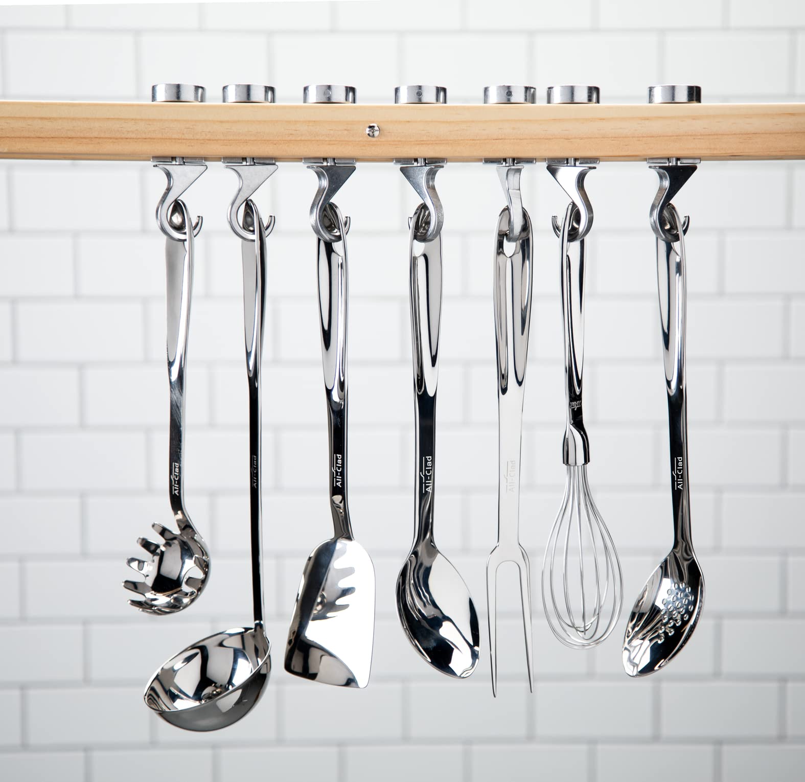 All-Clad whisk handle detail highlighting ergonomic grip and hang loop for easy storage