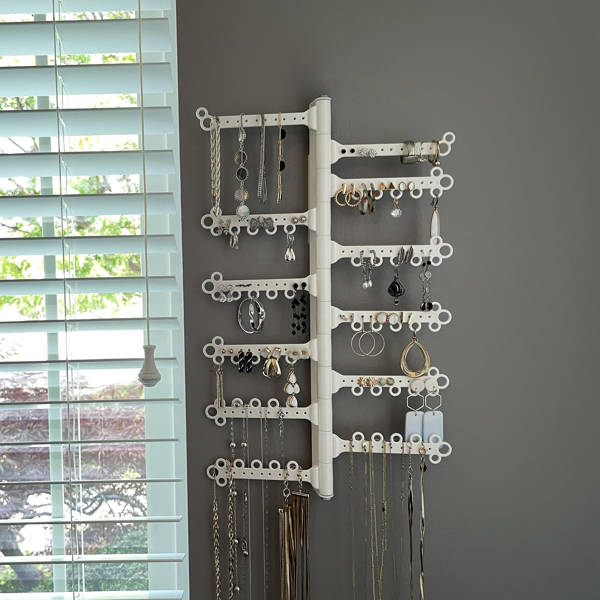 All Hung Up size comparison next to hand to show compact footprint