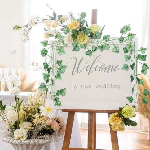 Alotiki vines draped over wedding arch creating full green backdrop