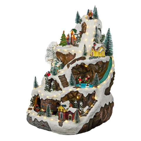 Alpine Corporation front view of full animated winter village, perfect holiday focal point