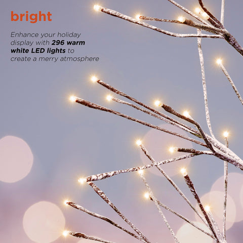 Alpine Corporation pre-lit tree at dusk with warm white LEDs creating cozy lighting