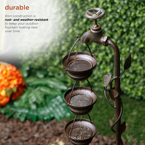 Alpine Corporation fountain in garden setting blending with plants and hardscape