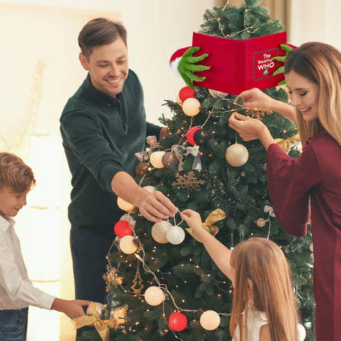 Amailtom elf perched on a pine tree for visual impact and festive focal point