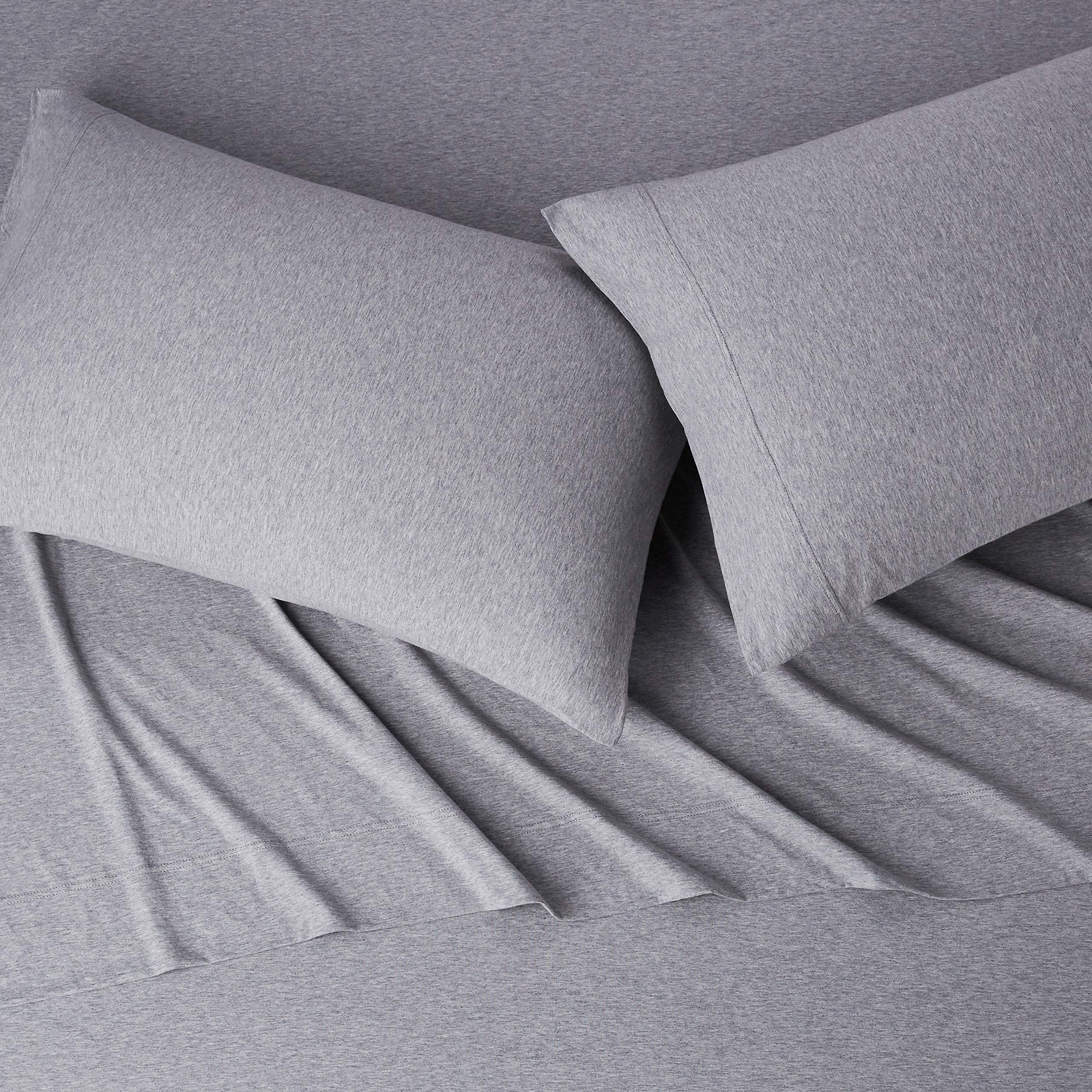 Amazon Basics light gray sheets on made bed illustrating neutral style and comfort
