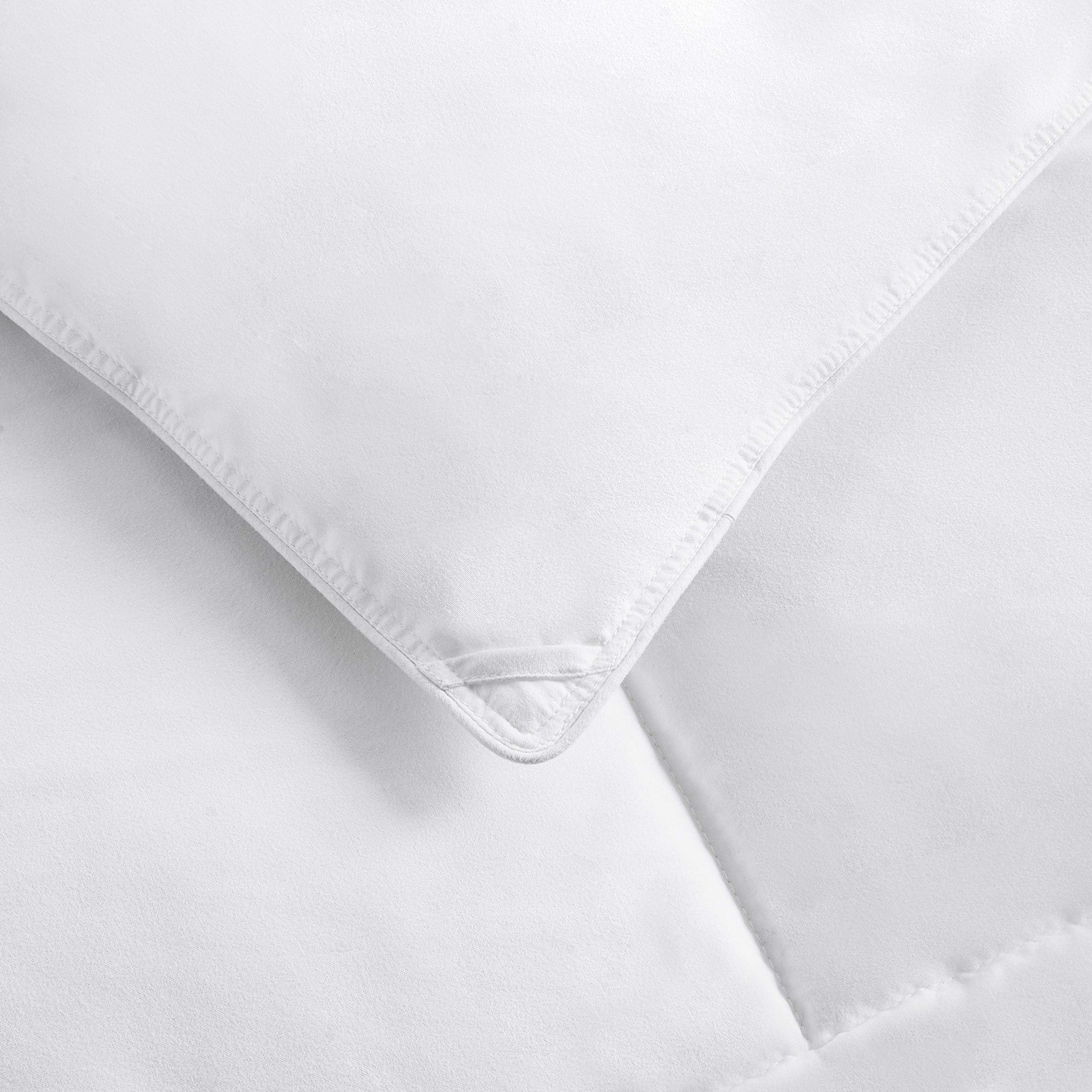Amazon Basics comforter dressed on king bed demonstrating loft and comfort