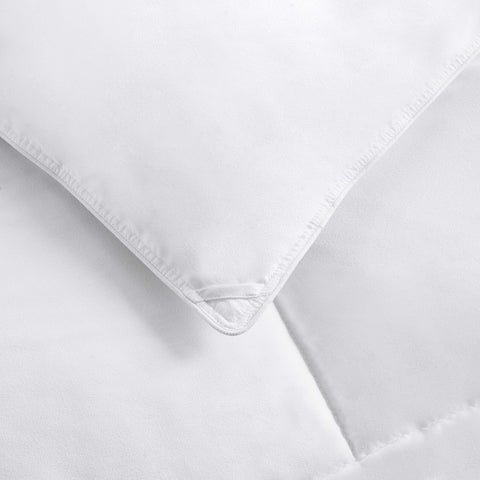 Amazon Basics comforter dressed on king bed demonstrating loft and comfort