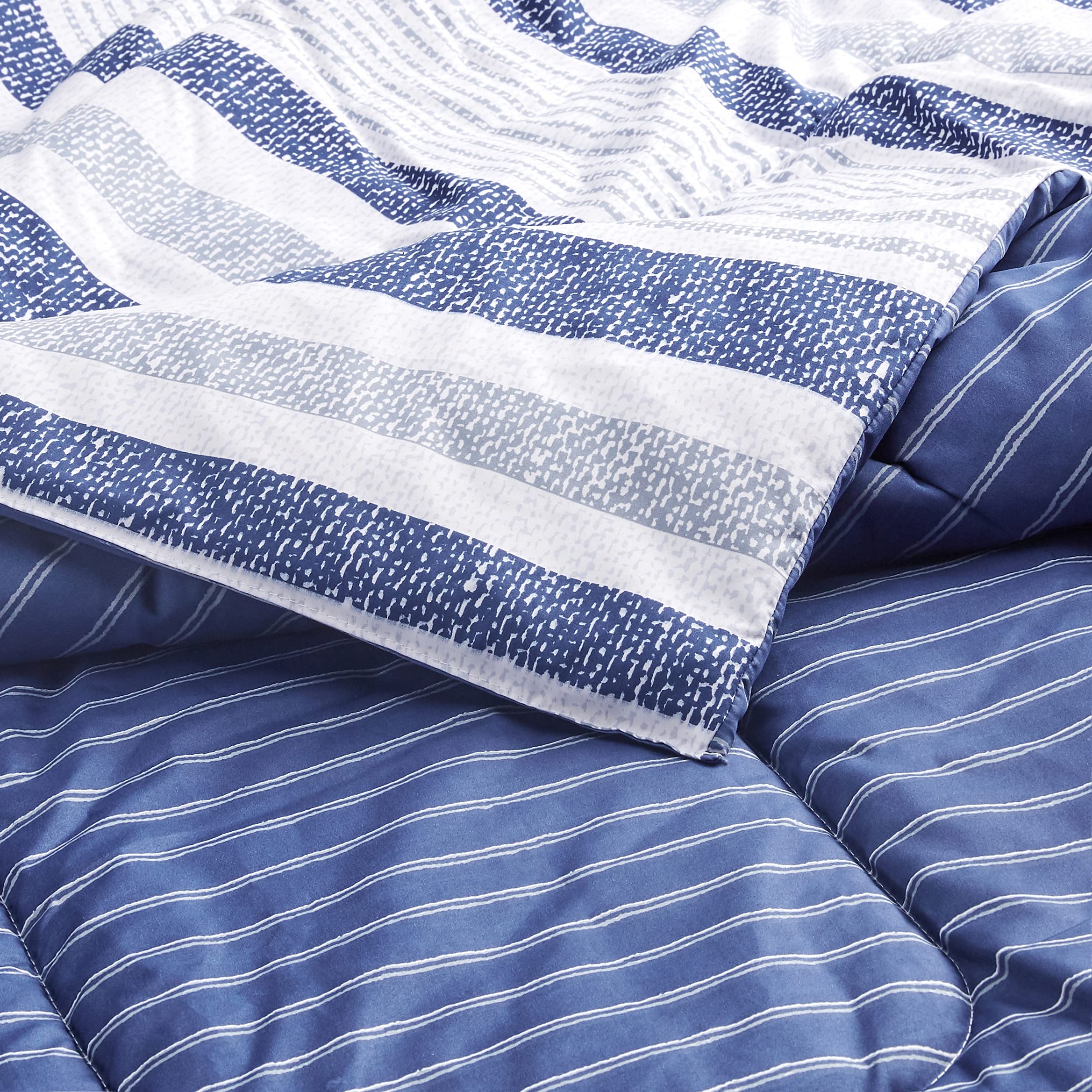 Amazon Basics comforter on a twin mattress showing fit and scale for small rooms