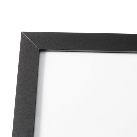 Amazon Basics frame on living room wall displaying poster and enhancing decor