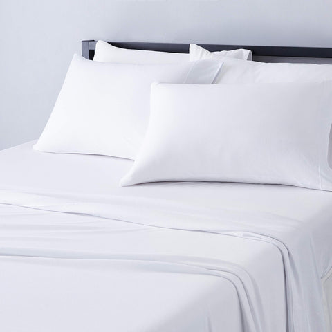 Amazon Basics front view of full sheet set showing clean white bedding and inclusive pieces