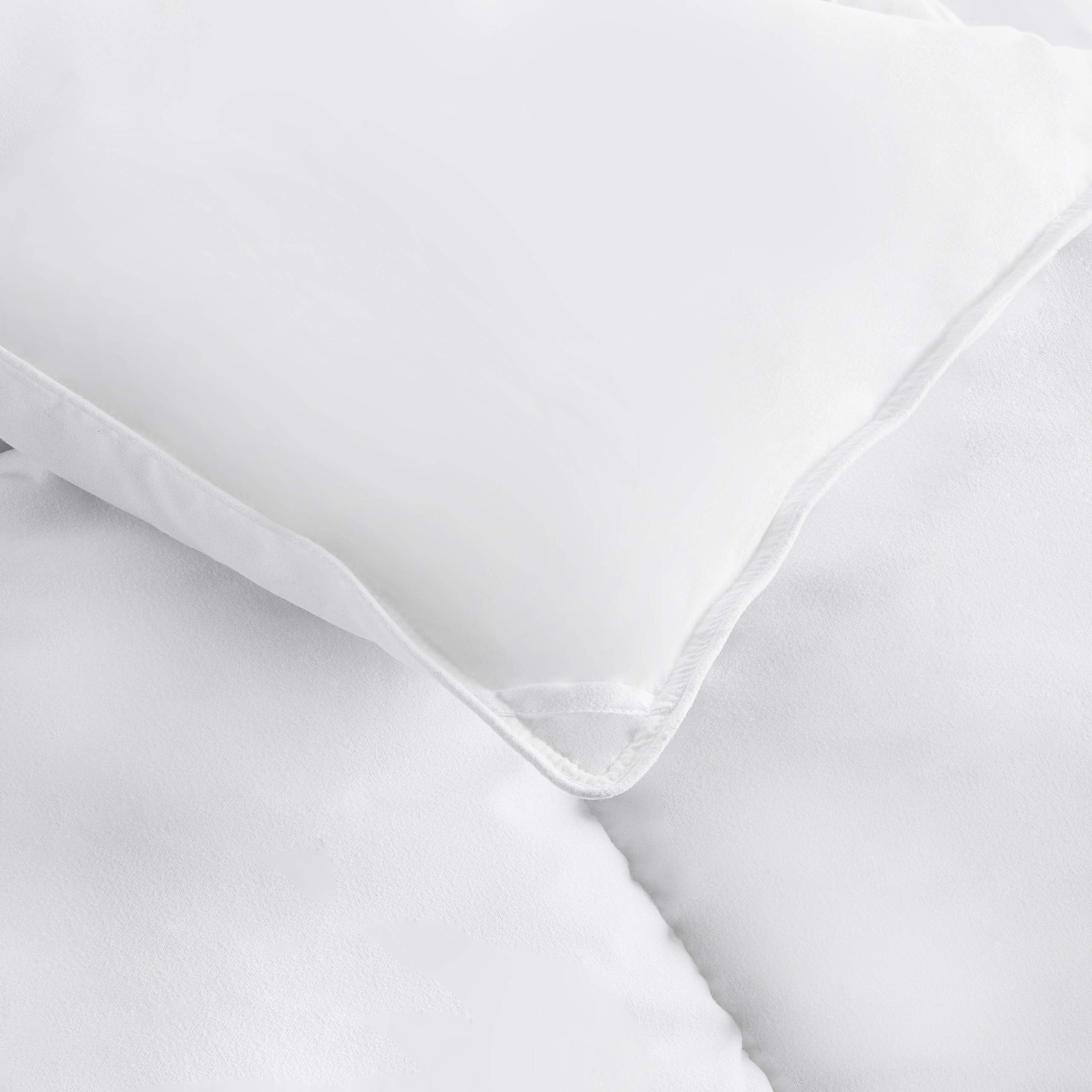Amazon Basics comforter on a made twin bed showing warmth and cozy bedroom styling