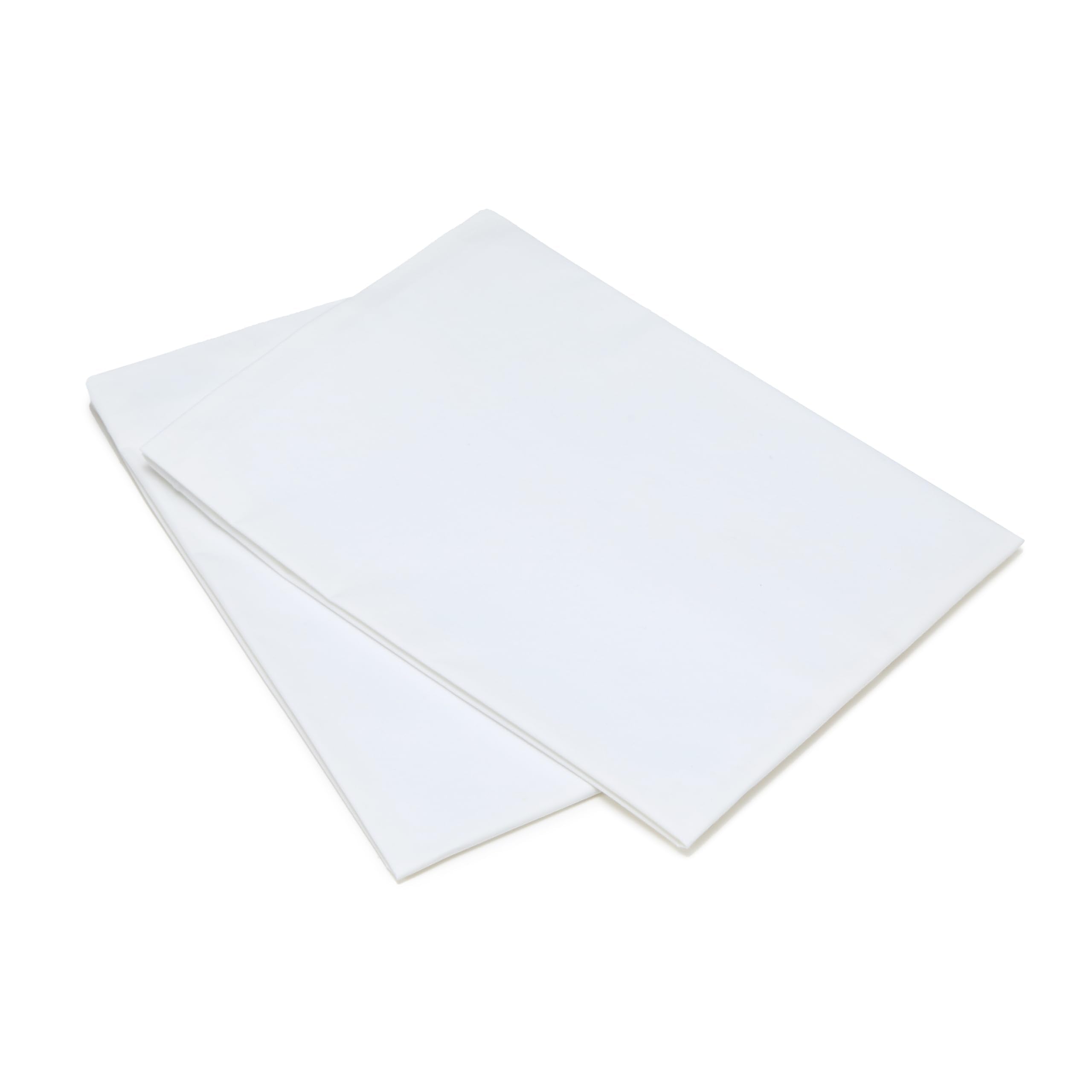 Amazon Basics pillows on bed under a sleeping stomach sleeper showing soft support