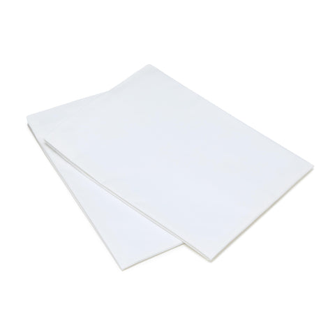 Amazon Basics pillows on bed under a sleeping stomach sleeper showing soft support