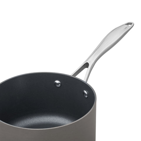 Amazon Basics saucepan on stovetop with simmering sauce, even heating benefit
