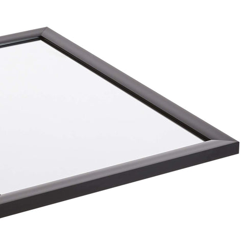 Amazon Basics mirror mounted vertically in bedroom creating taller visual space
