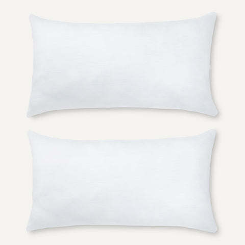 Amazon Basics pillow on a made bed illustrating medium support and sleep posture benefit