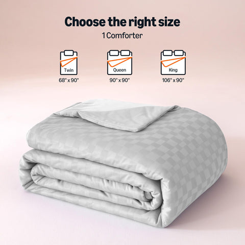 Amazon Basics folded comforter next to ruler showing 90x90 scale for fit