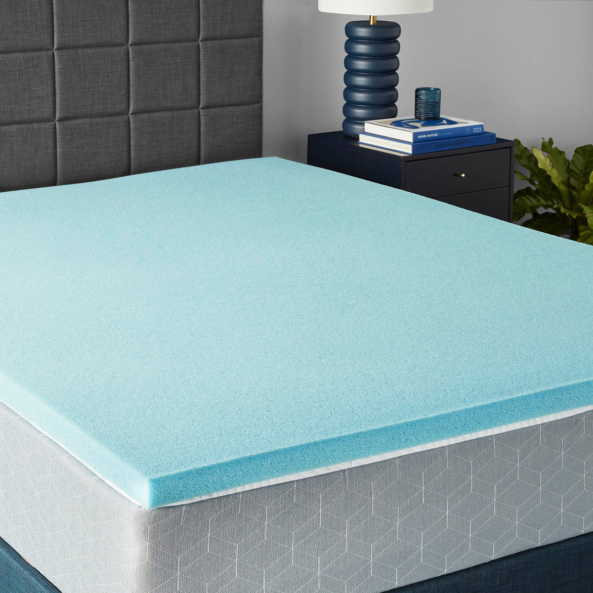 Amazon Basics topper on queen bed showing smooth surface and cooler sleep benefit
