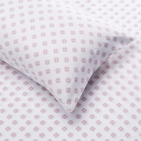 Amazon Basics styled bed in bedroom with pink floral comforter illustrating room-ready look