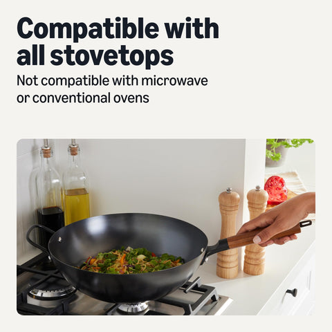 Amazon Basics pre-seasoned carbon steel surface detail showing early nonstick benefit