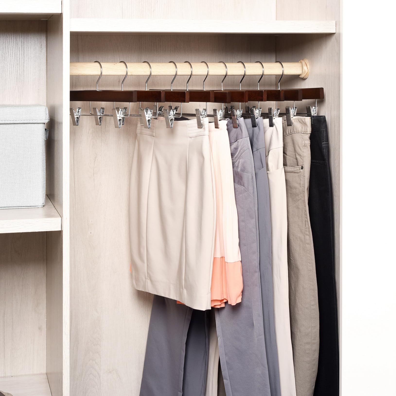 Amber Home hanger holding a pair of jeans demonstrating strong clip grip and crease prevention