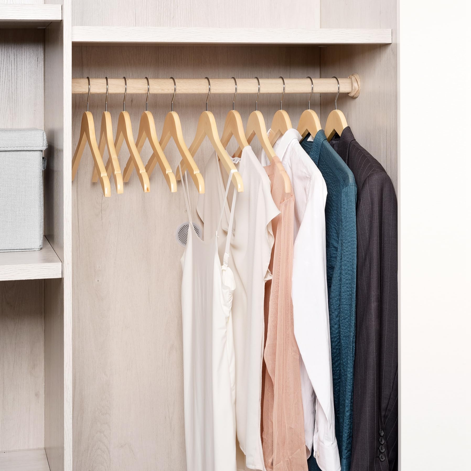 Amber Home hanger beside a shirt to show size and space-saving benefit