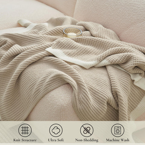 Amélie Home draped over sofa adding soft texture and comfort