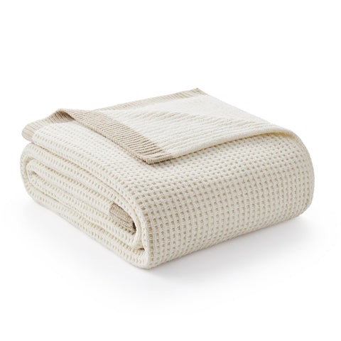 Amélie Home front-folded ivory throw showing neat edges and soft drape for quick styling