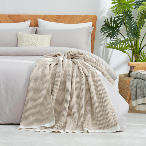 Amélie Home hand touching chenille showing soft velvety feel