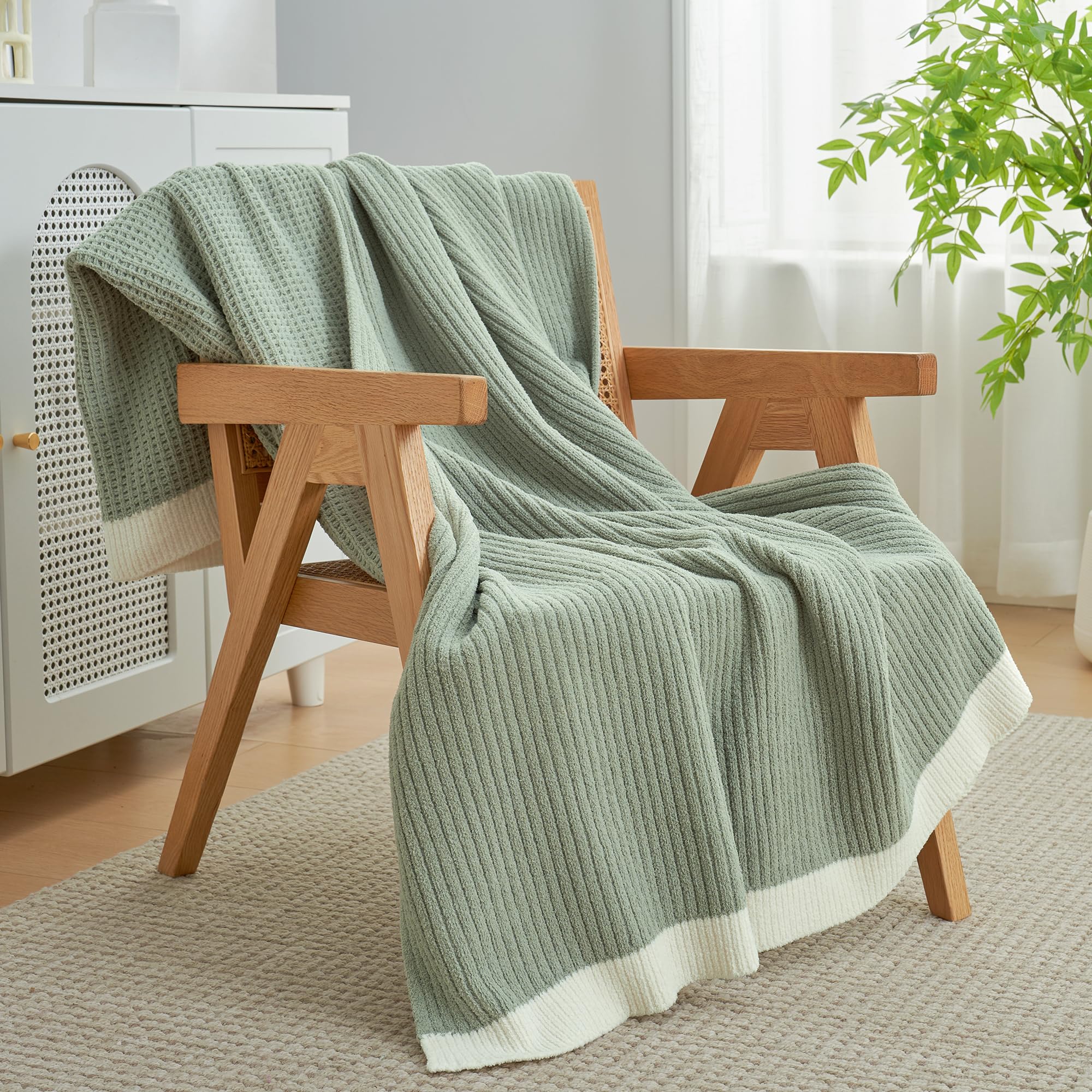 Amélie Home throw beside book to show scale and portability, convenient for reading or travel