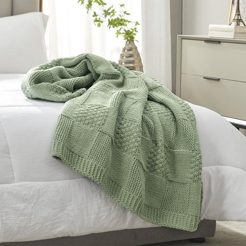 Amélie Home draped over foot of bed adding layered bedroom warmth