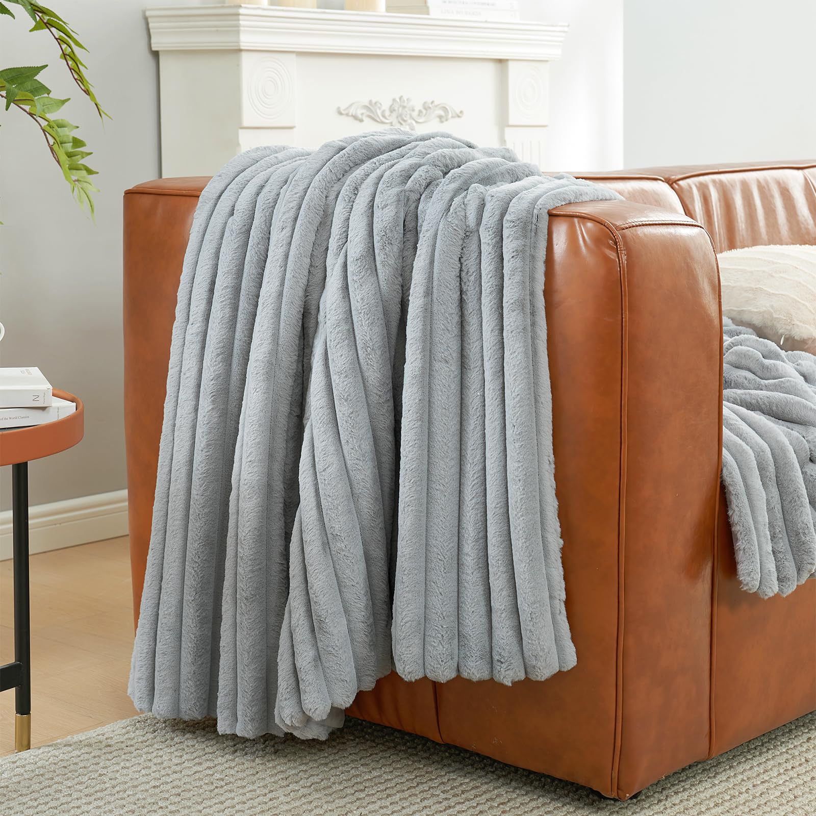 Amélie Home draped over bed adding elegant decor and extra warmth