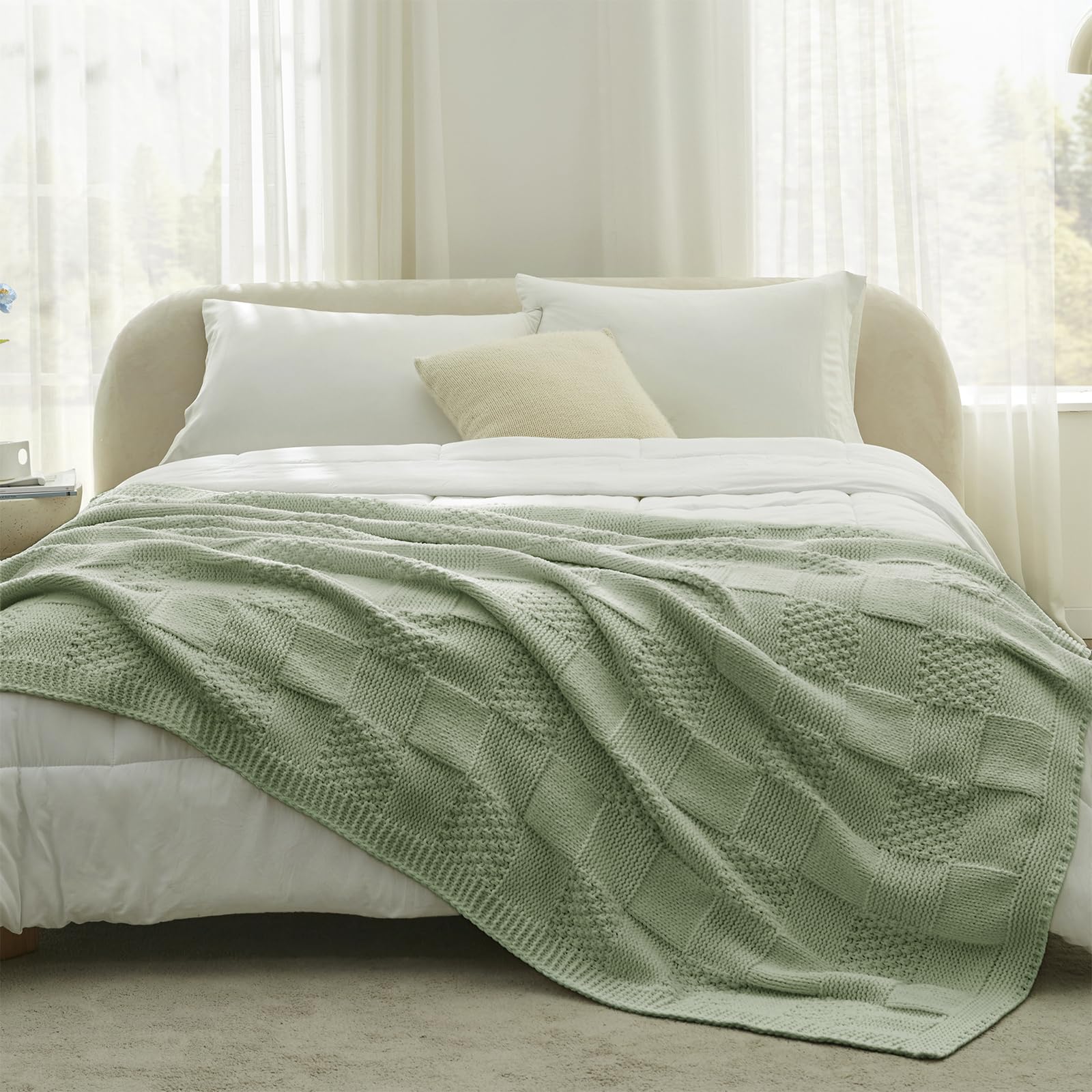 Amélie Home draped over sofa styling creating inviting living room comfort