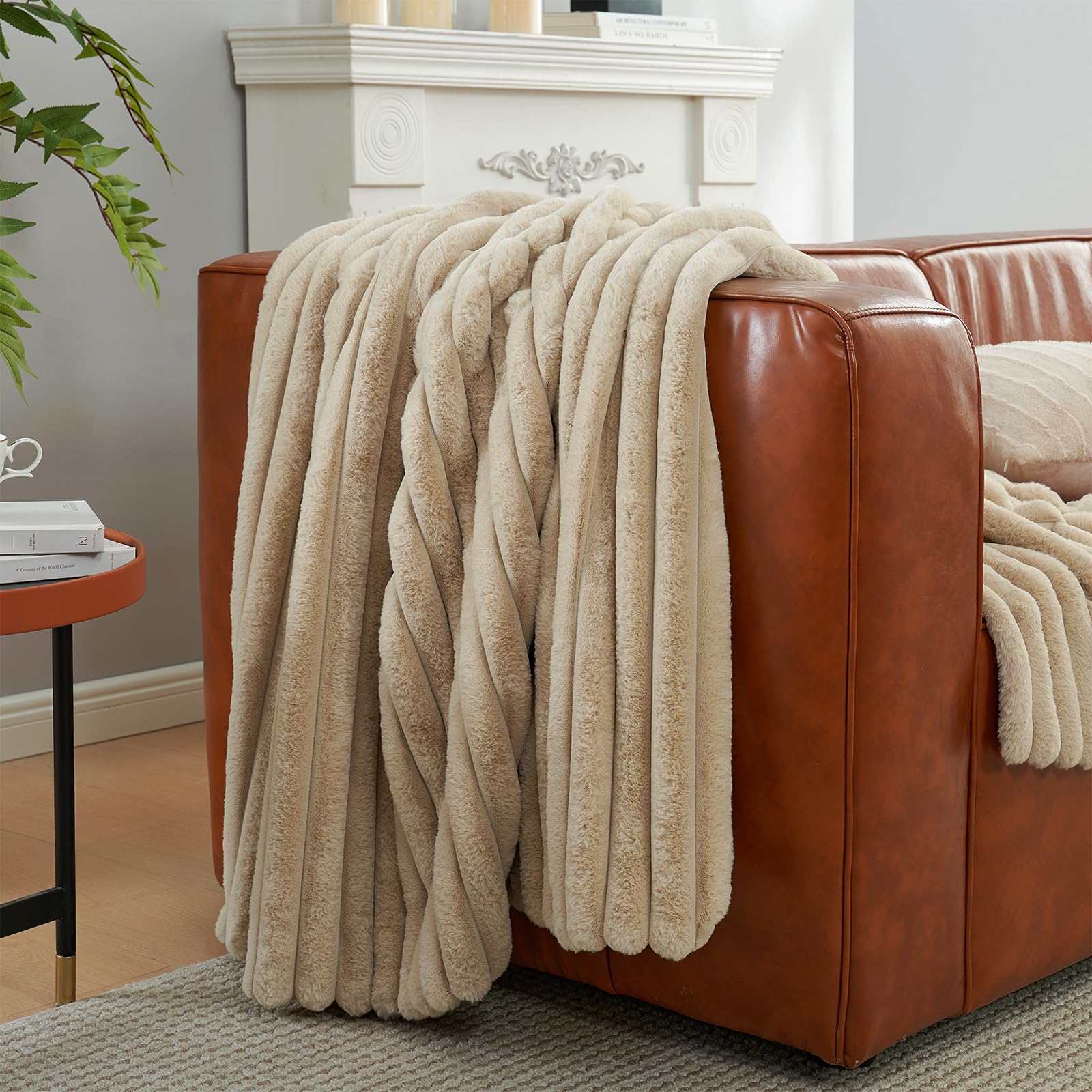 Amélie Home throw casually draped over sofa creating cozy sitting area