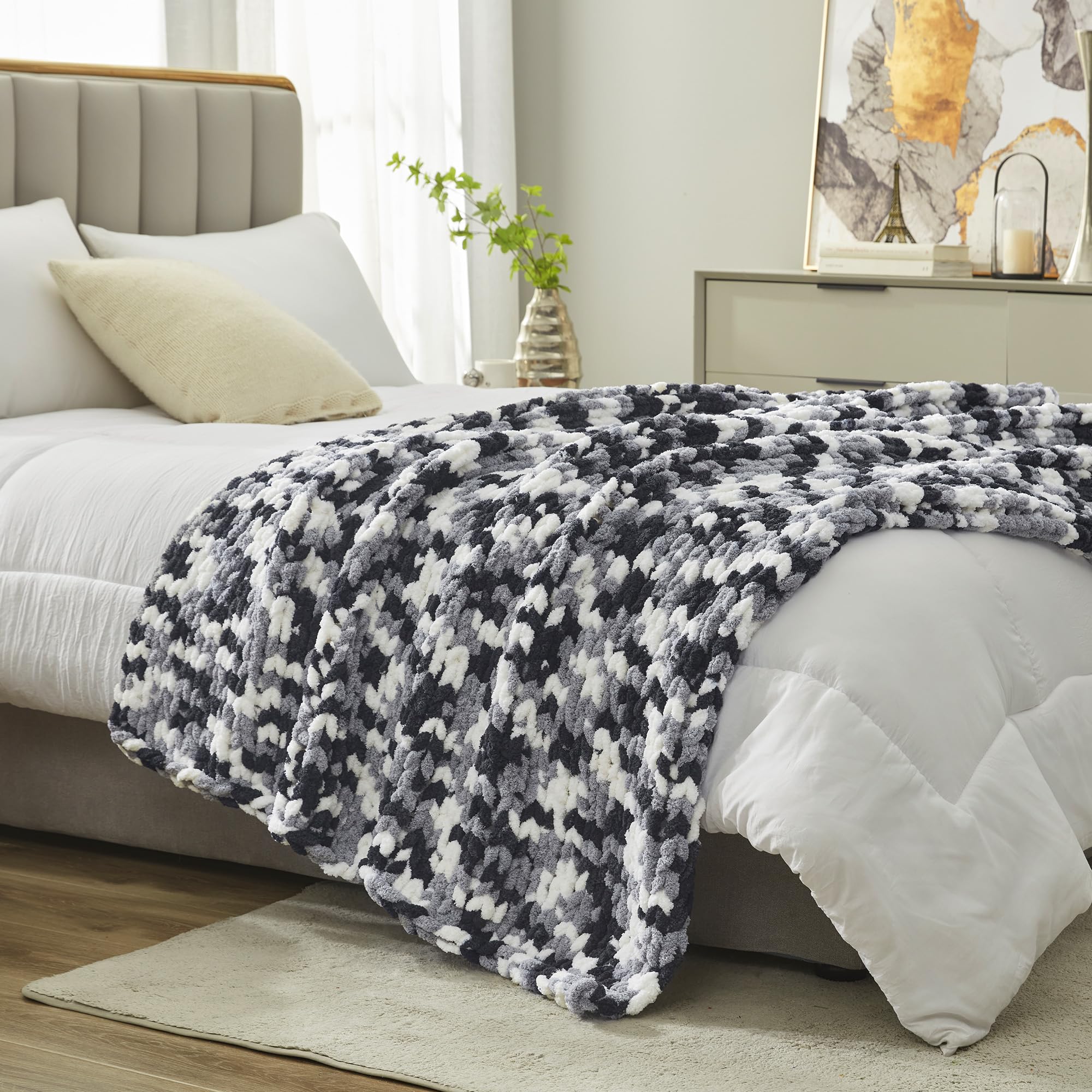 Amélie Home neatly folded throw on shelf highlights compact storage benefit