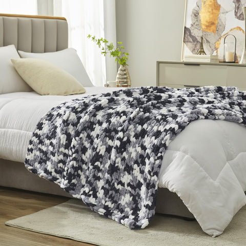 Amélie Home neatly folded throw on shelf highlights compact storage benefit