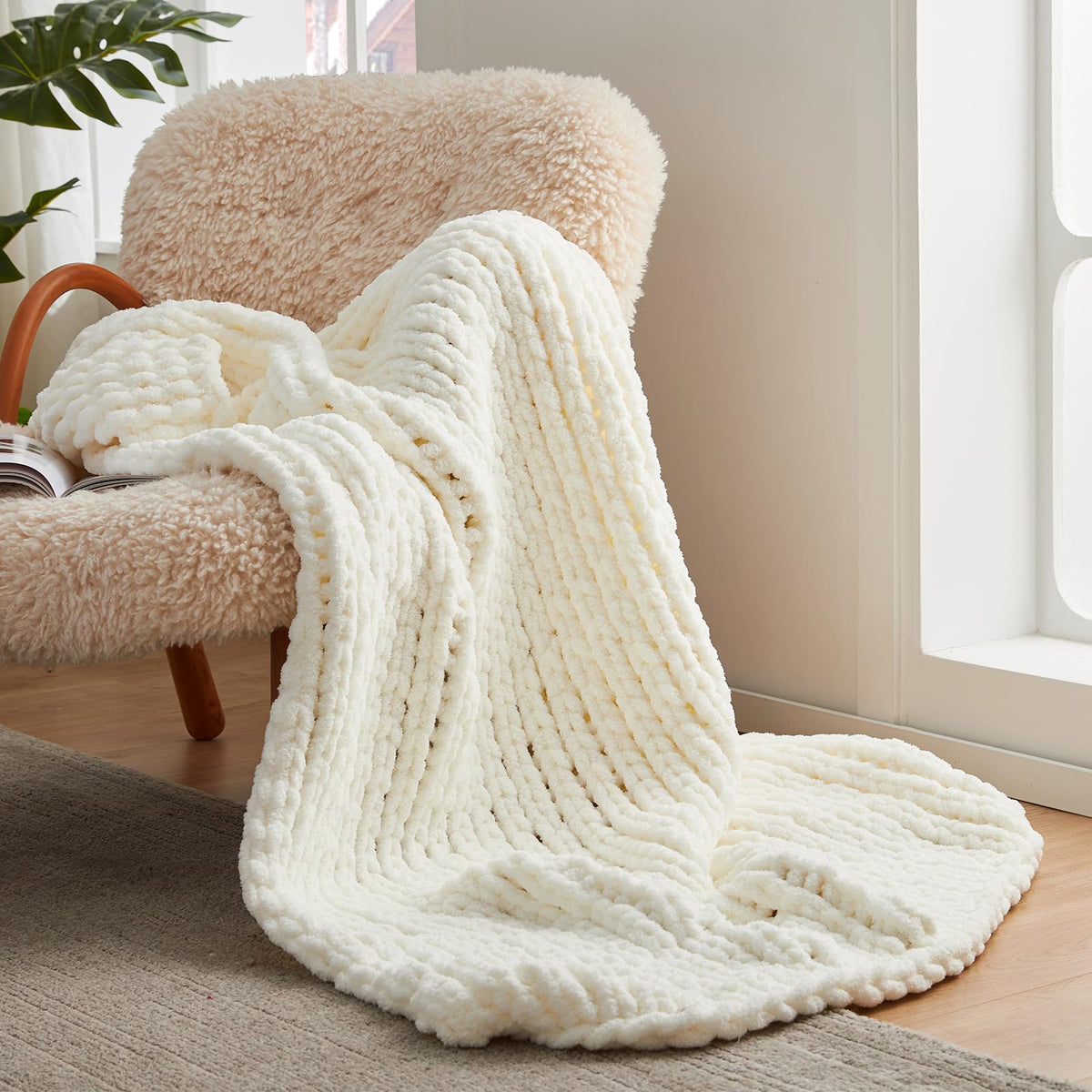 Amélie Home ivory throw folded showing neat edges and cozy look