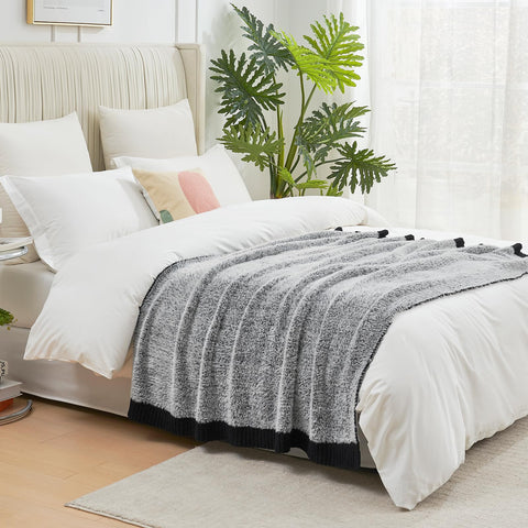 Amélie Home blanket with pet curled up showing pet-friendly softness and easy care