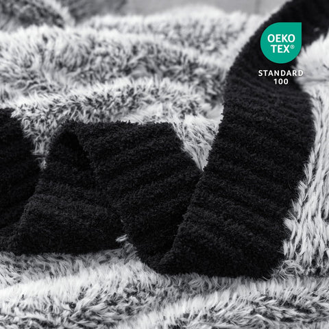 Amélie Home rolled blanket ready for travel, compact packing and portable comfort