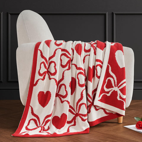 Amélie Home blanket on sofa for scale showing 50x60 size benefit