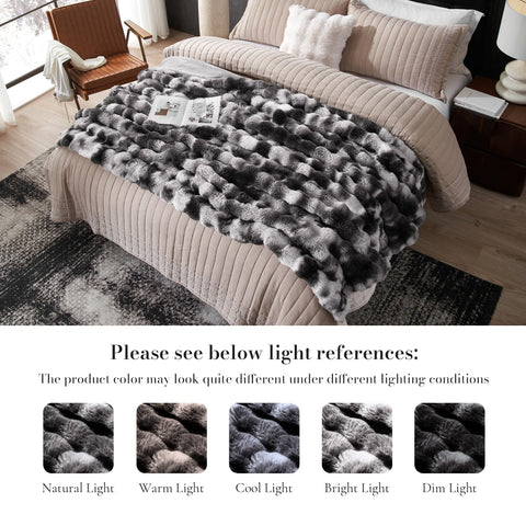 Amélie Home blanket draped on bed offering decorative depth and comfort