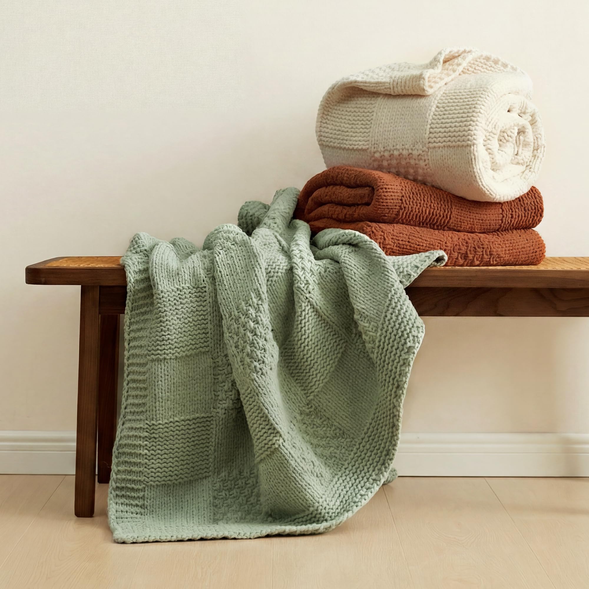 Amélie Home throw draped over sofa adding cozy, styled living room appeal