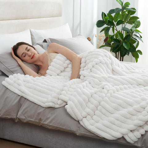 Amélie Home throw draped over sofa adding warmth and decorative elegance