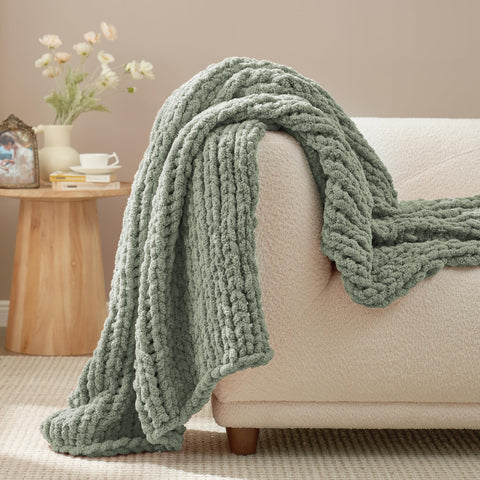 Amélie Home folded throw styled on shelf suggesting neat storage and decor benefit